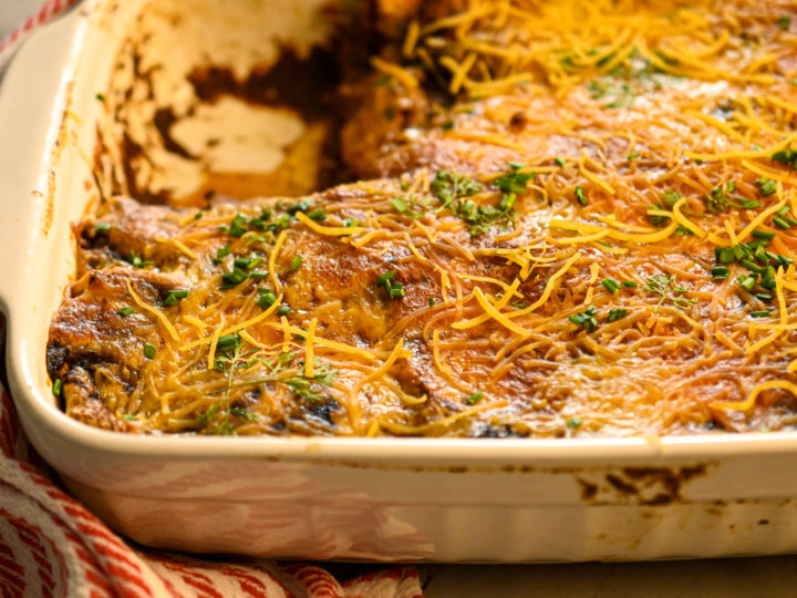 keto beef enchiladas baked in a white baking dish