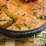 keto brown butter sage cornbread in cast iron slices with sage