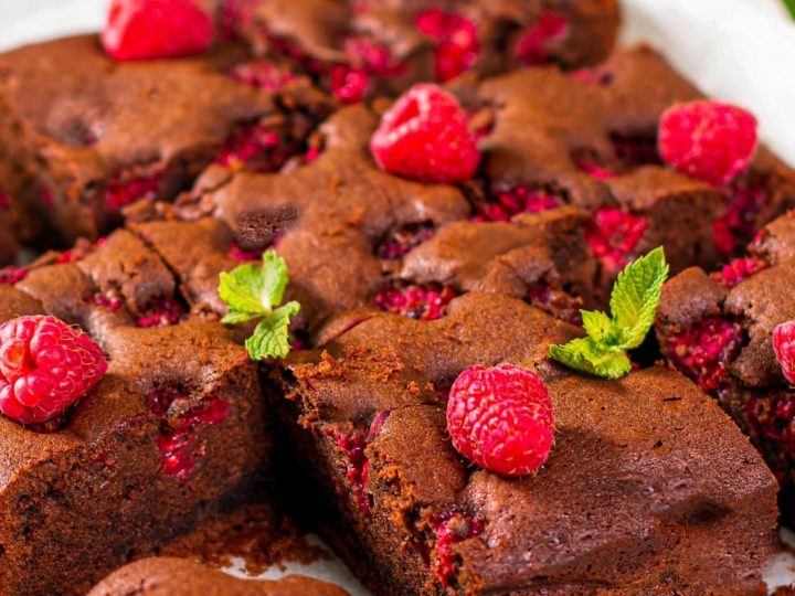 keto raspberry brownies on a white platter