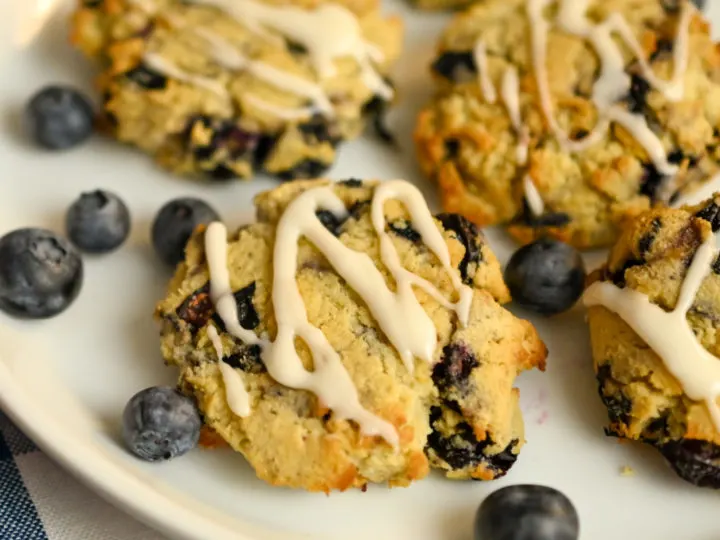 close up image of gluten-free blueberry cookies on a white plate