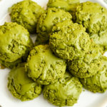 keto matcha coconut flour cookies stacked on a white plate