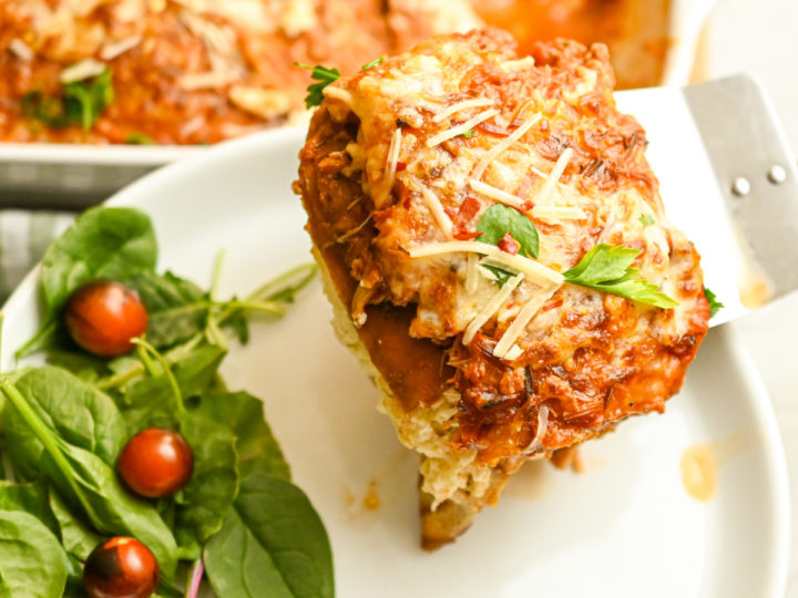 Crepini Keto Chicken Lasagna being served on a white plate