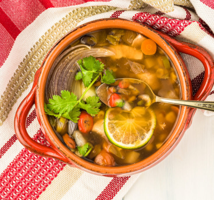 keto Southwest Chicken Soup in a red earthenware dish