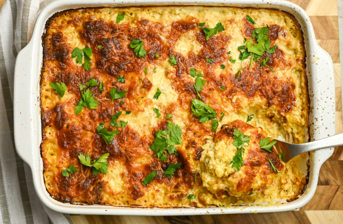 keto chicken Alfredo casserole with metal serving spoon