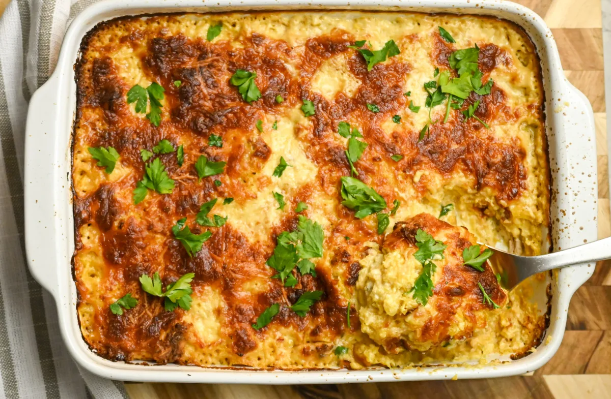 keto chicken Alfredo casserole with metal serving spoon