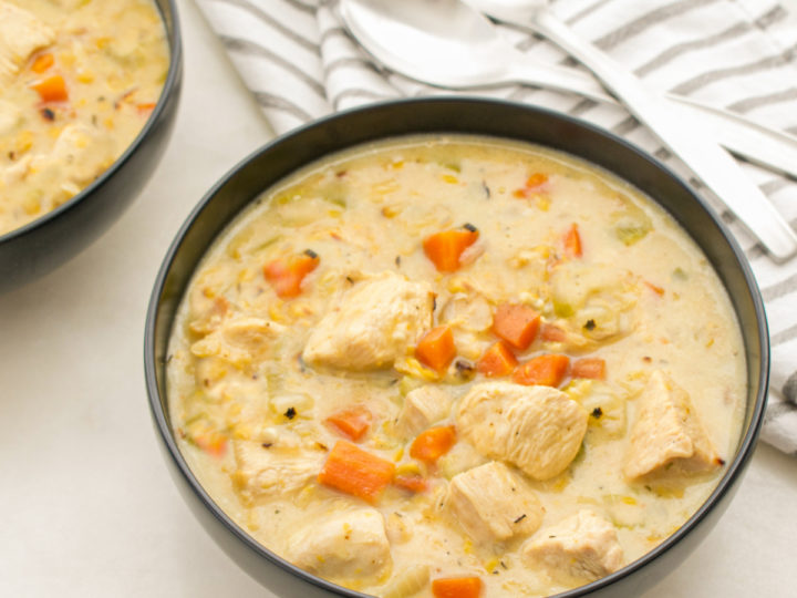 keto chicken bacon chowder served in black ceramic bowls