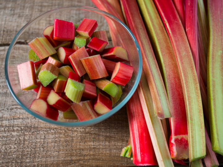 fresh rhubarb on a wooden board