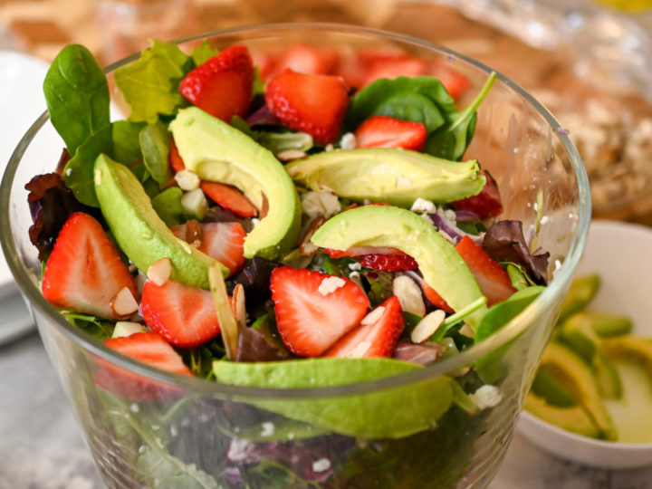 keto-friendly strawberry salad in a clear salad bowl