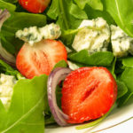 keto strawberry salad ready to dressed with strawberry vinaigrette