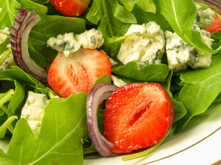 keto strawberry salad ready to dressed with strawberry vinaigrette