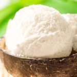 Keto coconut milk ice cream served in a hulled coconut shell