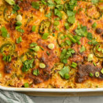 keto chicken taco casserole baked in a white large baking dish