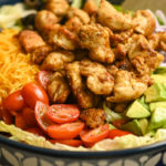 keto chicken taco salad served in a blue and white salad bowl