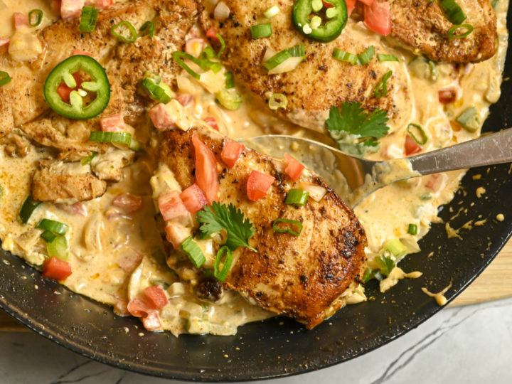 keto creamy jalapeño chicken cooked in a large skillet and ready to serve