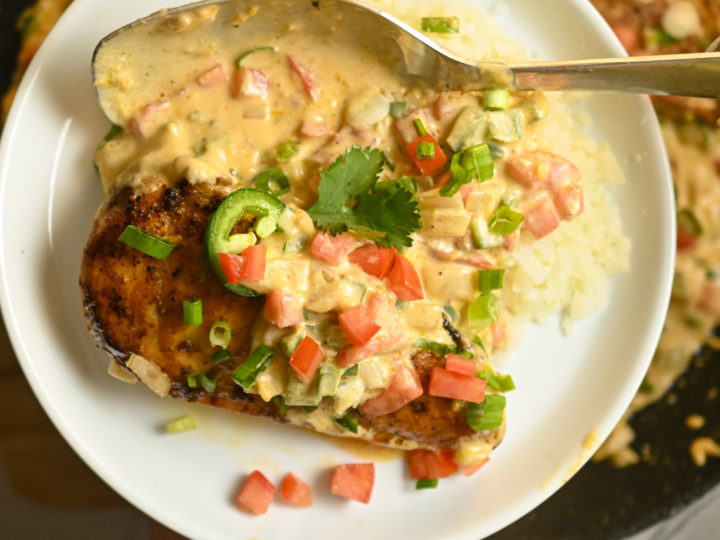 keto creamy jalapeño chicken served over a bed of cauliflower rice