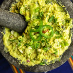 Spicy Guacamole Recipe made and served in a large mortar and pestle