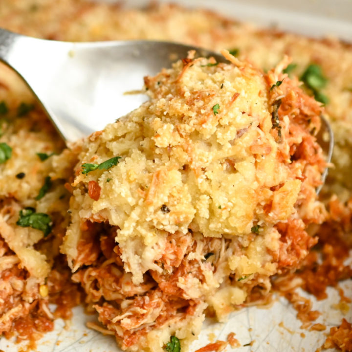 Keto chicken parmesan casserole being served