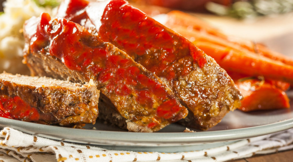 keto meatloaf served on a gray plate with a side of carrots and faux potato mash