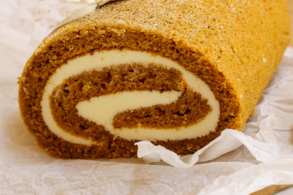 close up image of a keto pumpkin roll cake