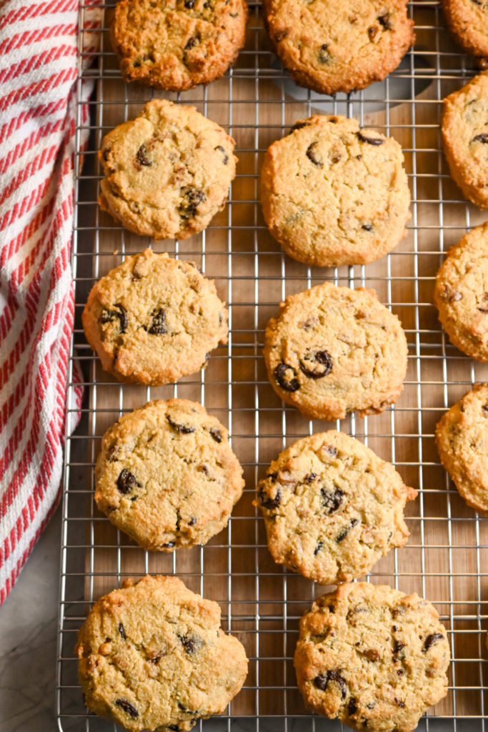 Keto friendly chocolate chip cookies on baking rack cooling