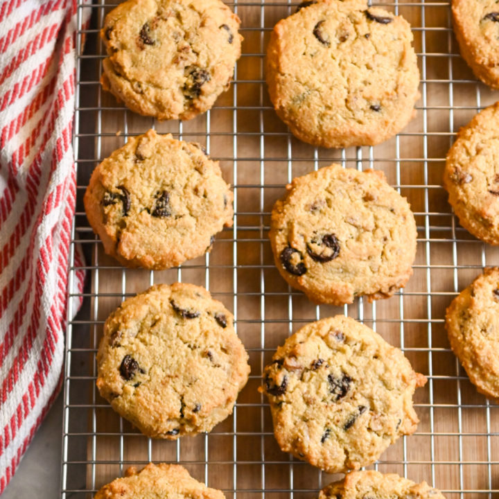 Keto friendly chocolate chip cookies on baking rack cooling