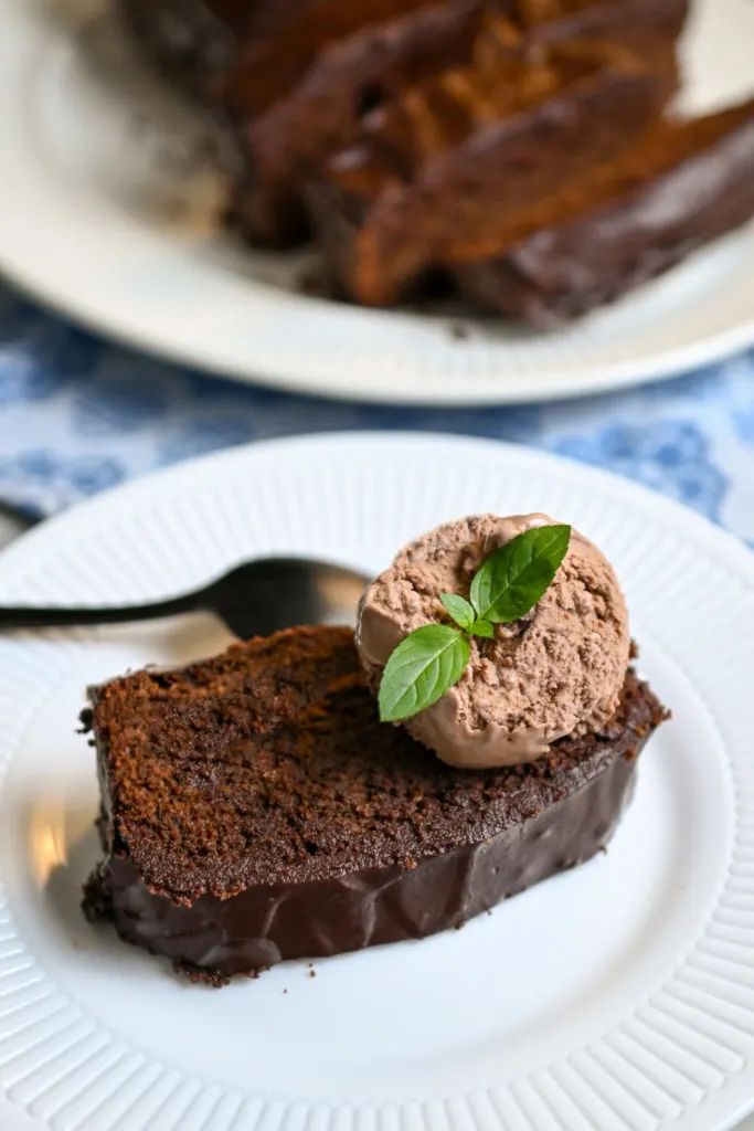 Keto cream cheese chocolate pound cake served with a scoop of keto chocolate ice cream