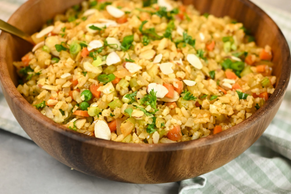 keto cauliflower pilaf rice served in a large wood bowl