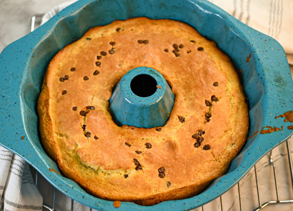 keto chocolate chip cake baked in a teal bundt pan