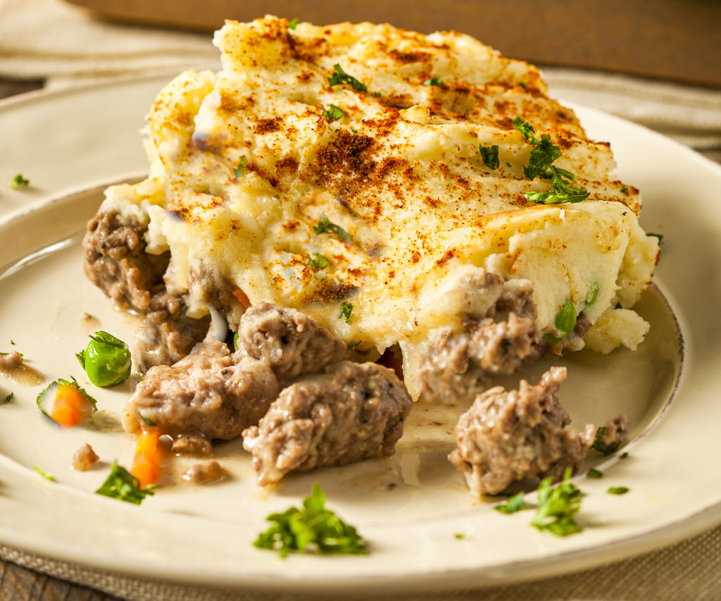 Keto shepherd's pie served on a beige plate