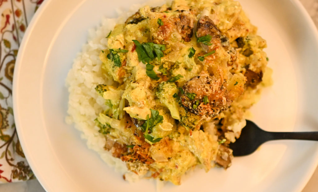 keto Divan chicken served of a bed of cauliflower rice