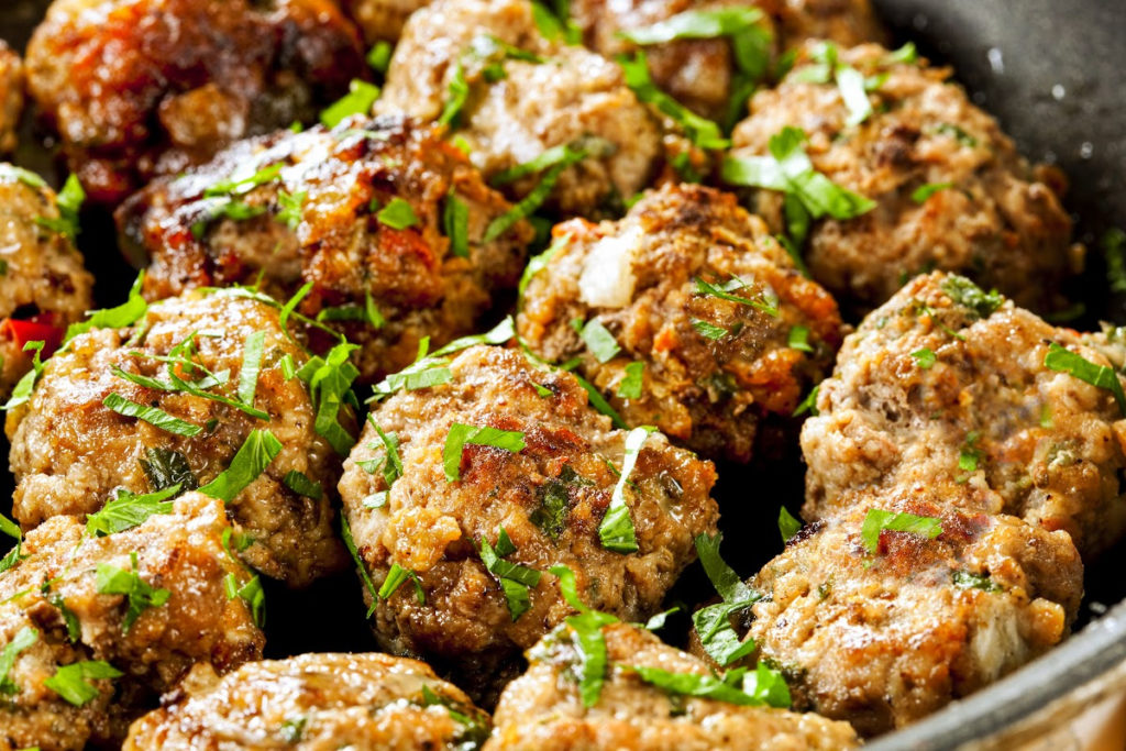 keto pastrami meatballs served in a black shallow bowl