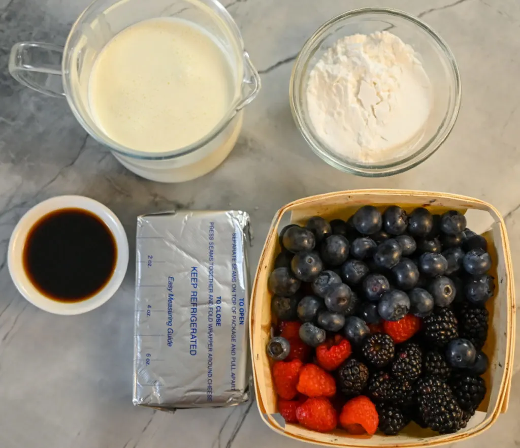 Ingredients needed to make a keto mixed berry cheesecake fluff