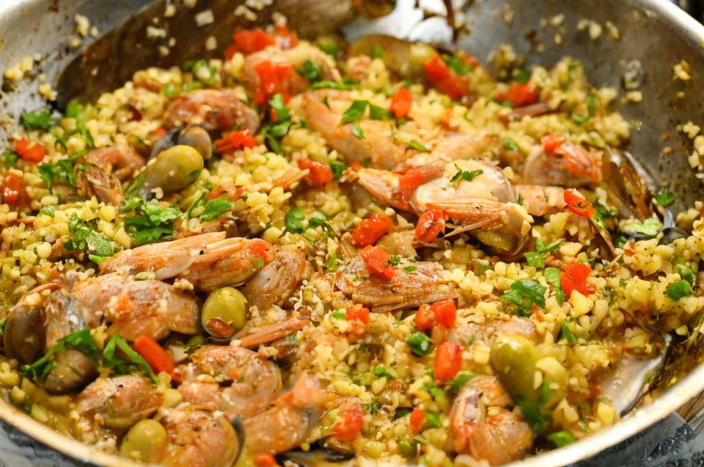 Keto paella cooked in a shallow pan