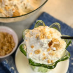 close up image of a keto peanut butter ice cream in a green cup