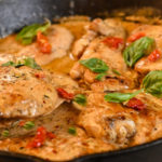 keto Tuscan chicken cooked in a cast iron skillet