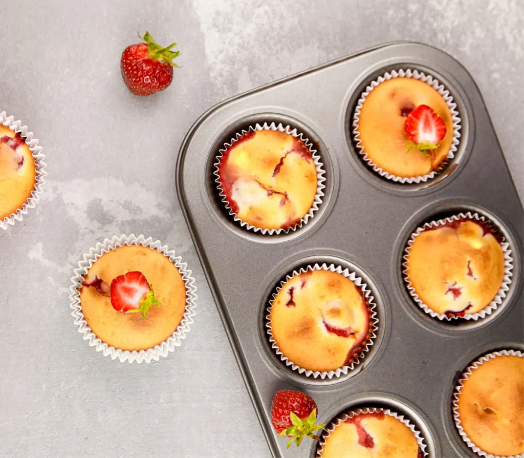 keto strawberry muffins baked in a muffin tin