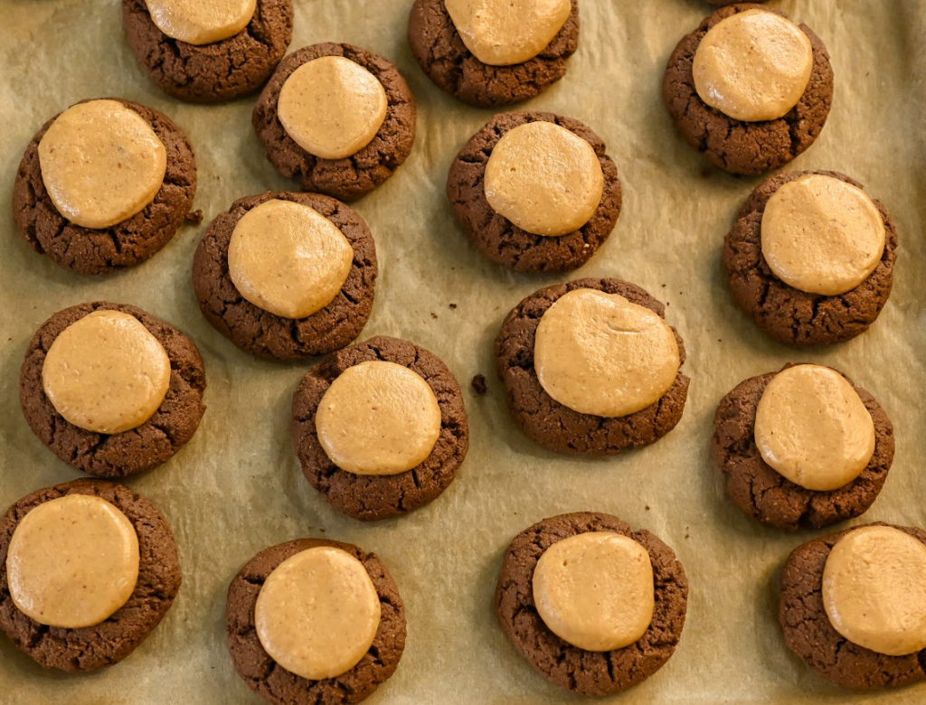 keto buckeye cookies ready to iced with chocolate ganache