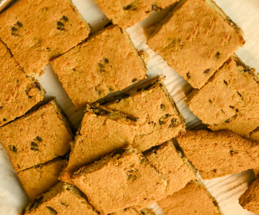 Keto-Friendly brown butter cookie bars baked and cut into squares