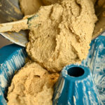 Keto banana cake batter being added to a bundt pan for baking