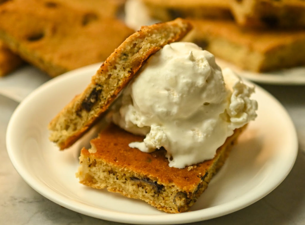 keto chocolate chip bars with a scoop of keto vanilla ice cream