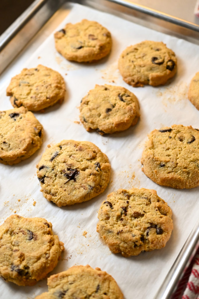 Low-carb pecan chocolate chip cookies cooling on a baking rack