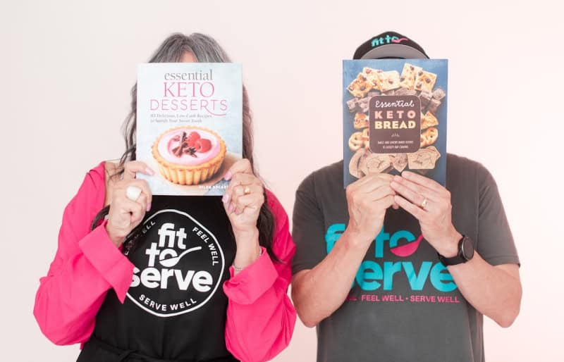Hilda & Randy holding our keto cookbooks