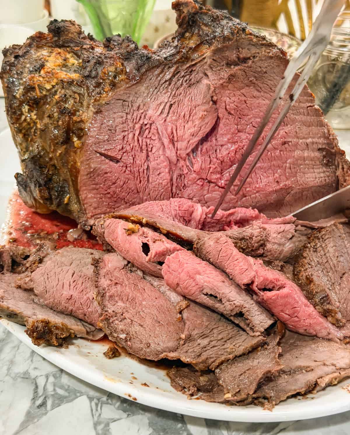 keto herb butter roast being sliced