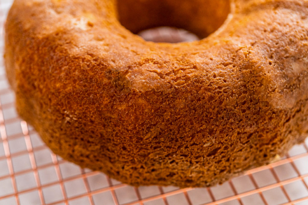 Keto-friendly yogurt cake cooking on a baking rack