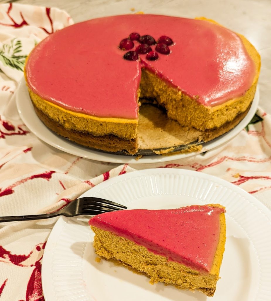 keto cranberry curd pumpkin cheesecake sliced and served