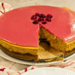 keto cranberry curd pumpkin cheesecake with a slice missing