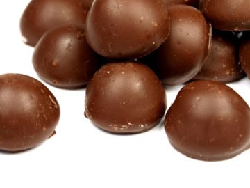 keto chocolate peanut butter fat bombs on a white plate