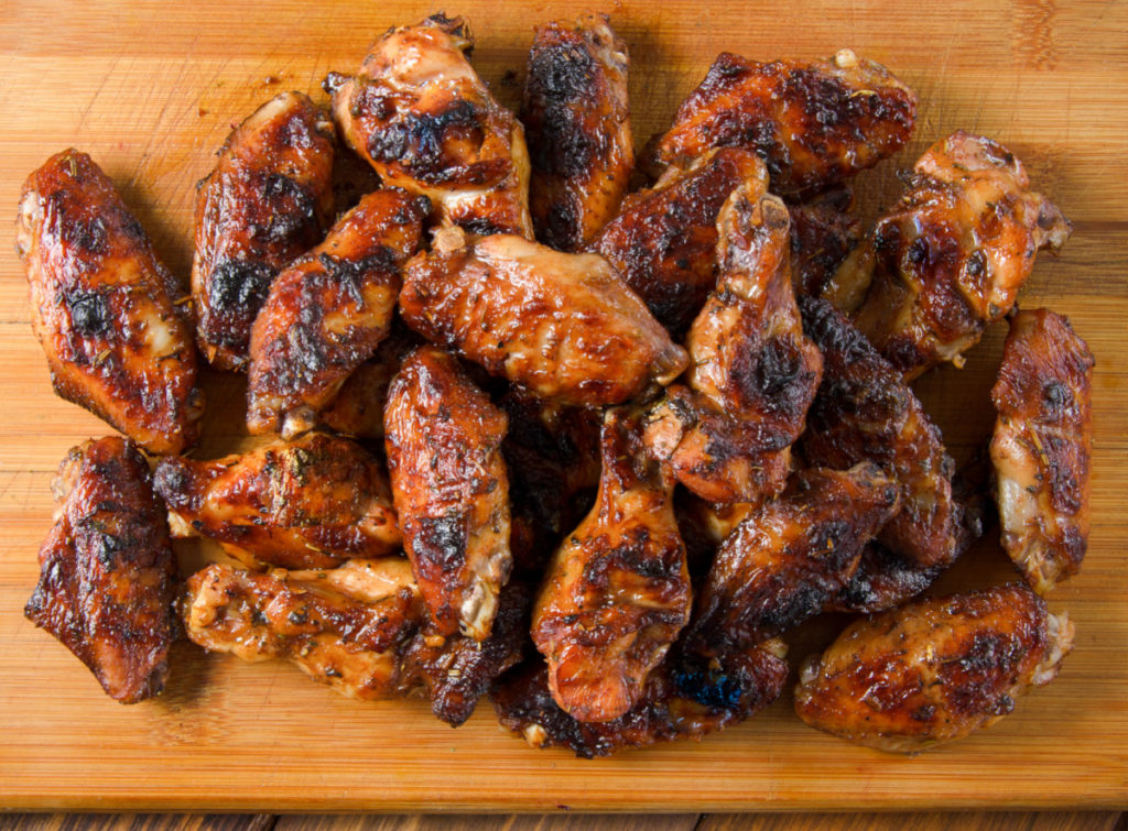 low-carb jerk wings on wooden cutting board