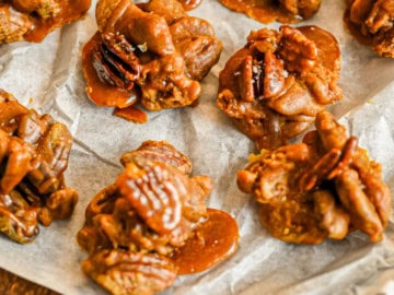 keto pralines on parchment paper on wood board