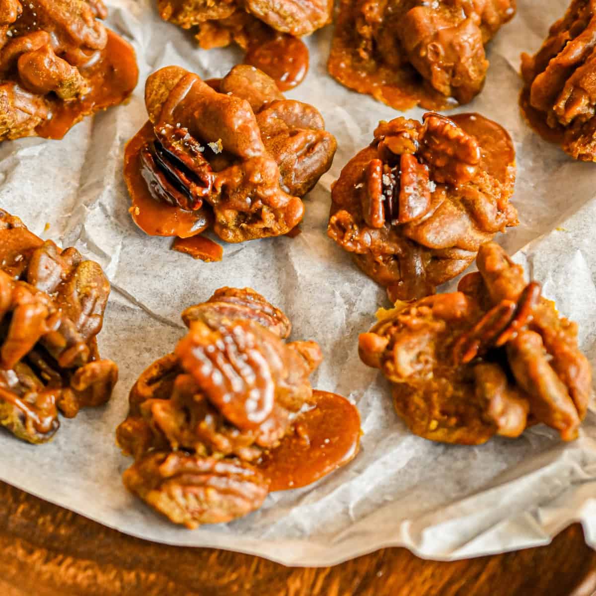 keto pralines on parchment paper on wood board
